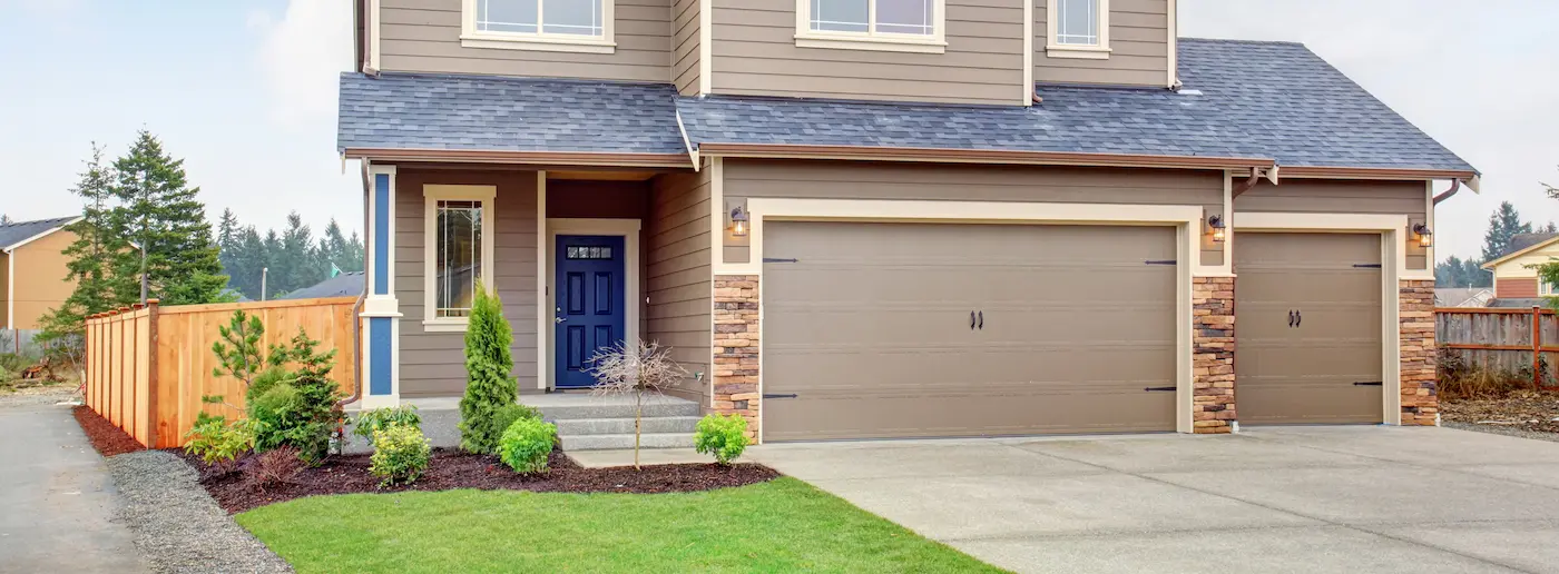Beige double and single garage doors Beige double and single garage doors